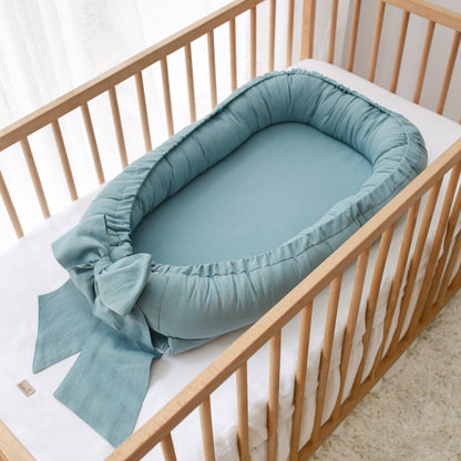 Linen babynest with bow