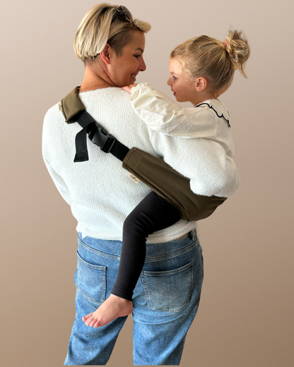 Child carrier, carrying support, carrying aid