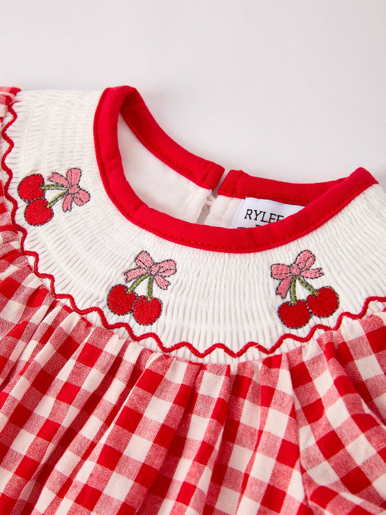 Red Cherry Bow Plaid Smocked Romper Rylee Faith Designs